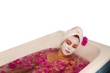 Image showing beautiful woman enjoying floral bath
