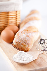 Image showing  bread, flour, eggs and kitchen utensil