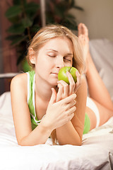 Image showing beautyful woman with green apple