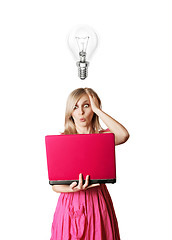 Image showing blonde in pink dress with laptop and bulb