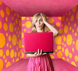 Image showing blonde in pink dress with laptop