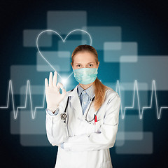 Image showing doctor woman with electrocardiogram