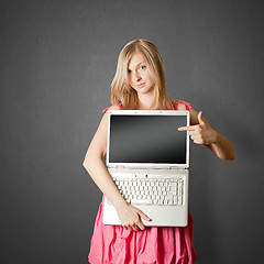 Image showing femaile in pink with open laptop