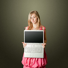 Image showing femaile in pink with open laptop