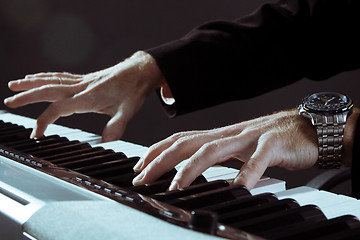 Image showing Playing the piano 