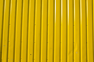 Image showing Wall made of yellow wooden planks. 