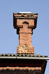 Image showing Antique red brick chimney.