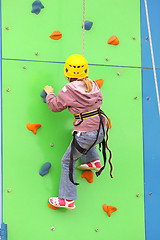 Image showing Child climbing on a climbing wall, outdoor