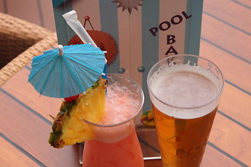 Image showing glass of fruit cocktail and a glass of beer