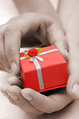 Image showing Hands and Gift Sepia