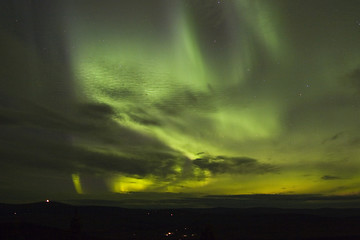 Image showing Northern lights under clouds