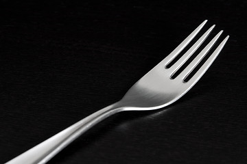 Image showing Silver fork on black background