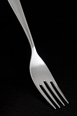 Image showing Silver fork on dark background