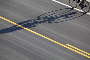 Image showing bike, road and shadow