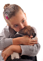 Image showing child and puppy