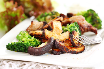 Image showing Roasted pork meat with shiitake mushrooms