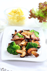 Image showing Roasted pork meat with shiitake mushrooms