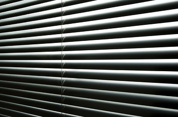 Image showing Light coming through closed metallic blinds
