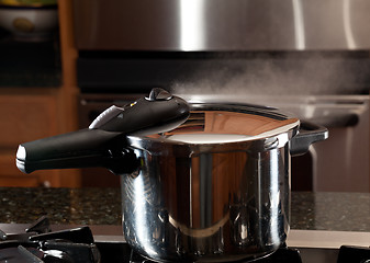 Image showing Steam escaping from new pressure cooker pot