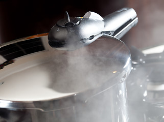 Image showing Steam escaping from new pressure cooker pot