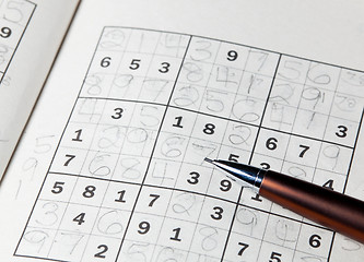 Image showing Pencil resting on sudoku book