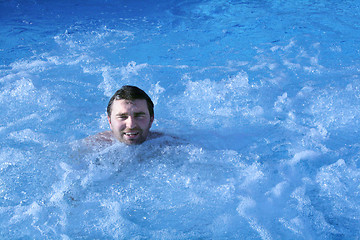 Image showing man in jacuzzi of spa center 