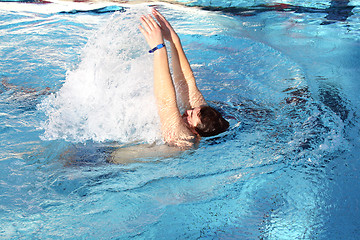 Image showing young man learn swimming backstroke in pool