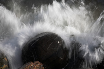 Image showing Water splashing on rocks 