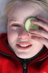 Image showing child and cucumber