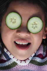 Image showing child and cucumber