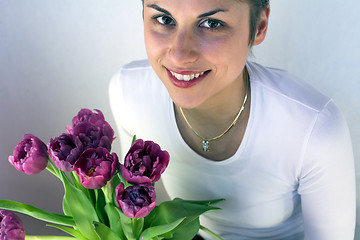 Image showing  woman holding flowers