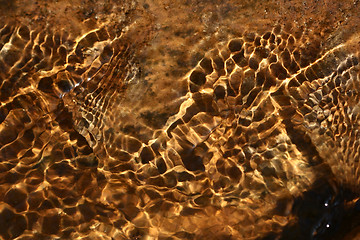 Image showing gold water