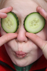 Image showing child and cucumber