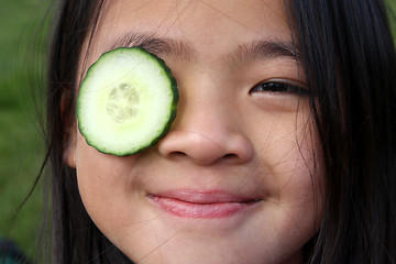 Image showing child and cucumber