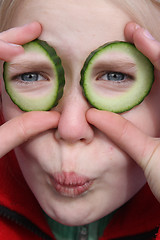 Image showing child and cucumber