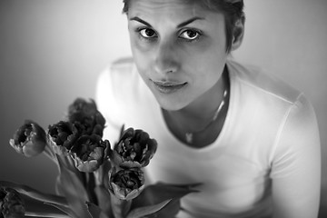 Image showing woman holding flowers