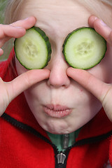 Image showing child and cucumber