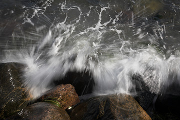 Image showing Water splashing on rocks 