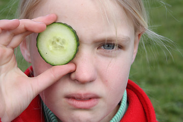 Image showing child and cucumber