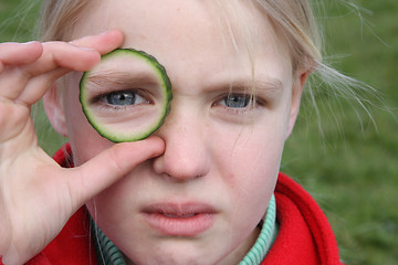 Image showing child and cucumber