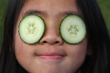 Image showing child and cucumber