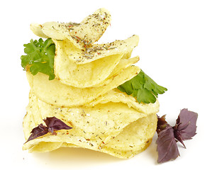 Image showing Potato Chips pyramid with basil and parsley
