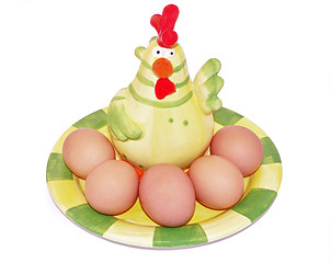 Image showing Eggs on green plate with hen decorative