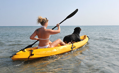 Image showing woman and dog on a kayak