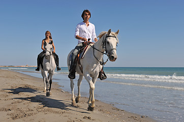 Image showing horseback riding on the beach