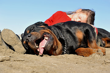 Image showing child and rottweiler