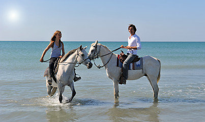 Image showing horseback riding in the sea