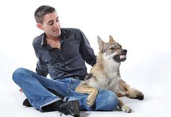 Image showing man and angry wolf