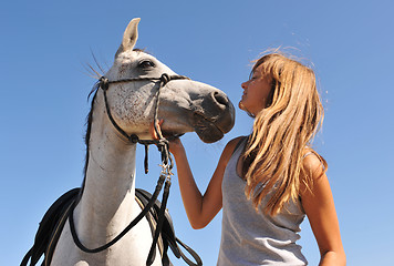 Image showing child and young horse