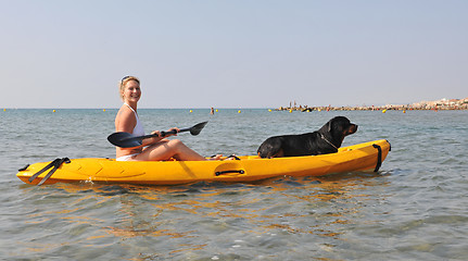 Image showing woman and dog on a kayak